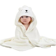 a baby wrapped in a polar bear blanket