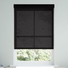 a window with black shades in a white room