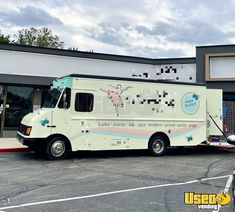 an ice cream truck parked in front of a building