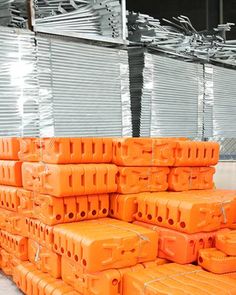 orange plastic containers stacked on top of each other