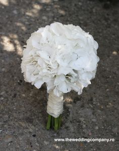 a bouquet of white flowers on the ground