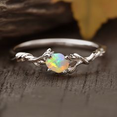 opal ring Unique Womens Rings, Unique Engagement Rings Opal, Engagement Rings With Opal, Elvish Engagement Rings, Promise Ring Ideas, Opal Engagement Ring Silver, Earthy Engagement Rings, Ethereal Engagement Ring, Simple Opal Ring