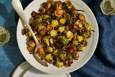 a white bowl filled with cooked brussel sprouts