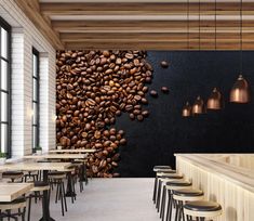 the interior of a restaurant with tables and stools next to a wall covered in coffee beans