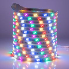 multicolored led strip light on white background with reflection in the floor and back ground