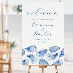 an easel with a sign on it that says welcome to the bride and groom