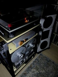 an old record player sitting on top of a shelf