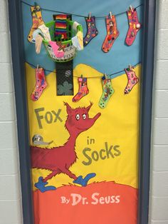 a classroom door decorated with socks and toys