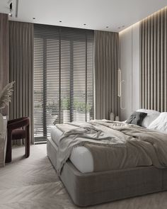 a large bed sitting in the middle of a bedroom next to a window with blinds