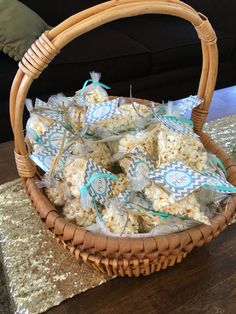 a basket filled with popcorn sitting on top of a table