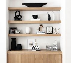 a wooden shelf with various items on it