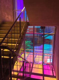 the stairs are lit up with colorful lights and there is no image on it to describe