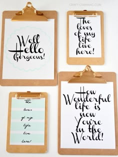 three clipboards with handwritten words on them, one has a clipboard attached to it