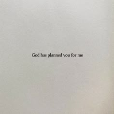 a white wall with the words god has planned you for me written on it in black