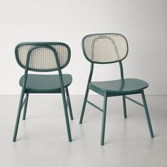 two green chairs sitting next to each other