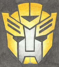 a drawing of a yellow and black transformer logo on paper with colored pencils