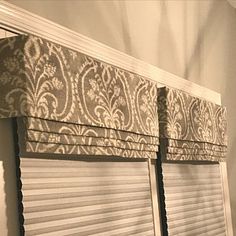 the blinds in this room are made to look like damask