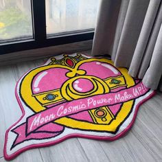 a pink rug with the words mom cosmic power model life on it in front of a window