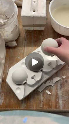 someone is making an egg carton out of eggshells