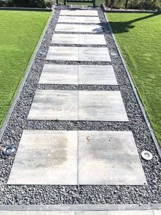 a walkway made out of stones and gravel