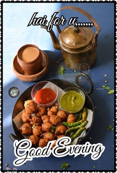 some food is on a plate with sauces and a tea pot next to it