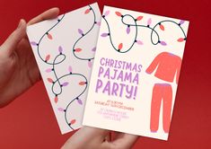 someone holding up a christmas pajama party card in front of a red background