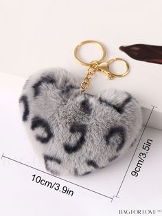 a keychain with a leopard print on it