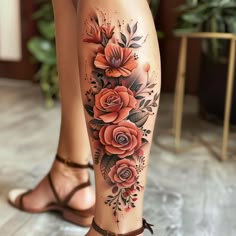 a woman's legs with flowers and leaves on them