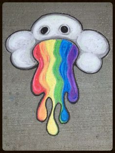 a chalk drawing of a cloud with rainbow paint dripping from it's mouth and eyes