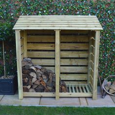 a wooden firewood storage shed with logs stacked in the front and side by side