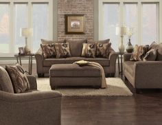 a living room filled with furniture and windows