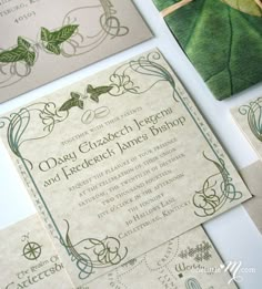 the wedding stationery is laid out on top of each other