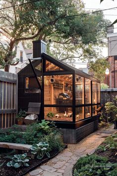 a small house with an enclosed patio and garden area