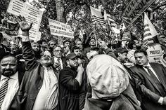 a large group of people holding up signs