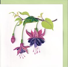 paper cut flowers with green leaves and purple petals on a white background, hanging from a twig