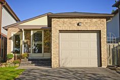 a house with two garages in front of it