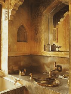 a bath room with a sink and a mirror on the wall next to a tub