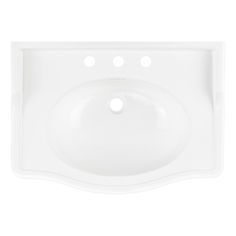 a white sink with four holes in the middle