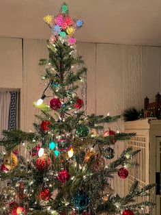 a decorated christmas tree with lights and ornaments