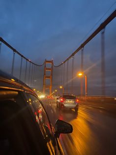 cars driving over the golden gate bridge at night