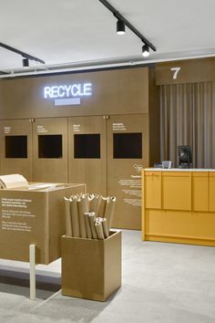 an office with cardboard boxes stacked on top of each other in front of a reception counter