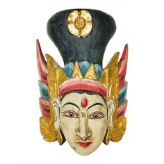 a mask with gold and blue decorations on it's head, against a white background