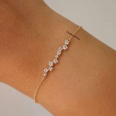 10k Gold Cluster Dainty Bracelet, Constellation Diamond Wedding Bracelet, Sparkling Round Cut Lab Grown Diamond Bracelet, Tennis Bracelet   ✹✹𝐖𝐞𝐥𝐜𝐨𝐦𝐞 𝐭𝐨 𝑻𝒉𝒆𝑩𝒂𝒏𝒅𝒔𝑺𝒉𝒐𝒑✹✹ ★ 𝑺𝒕𝒐𝒏𝒆𝒔 𝑫𝒆𝒕𝒂𝒊𝒍𝒔 ★ ● Stone Shape:- Round Cut ● Stone Type:- Simulated Diamond, Moissanite, Lab-Diamond & Natural Diamond ● Stone Size:- 2.50 mm ● Color:- DEF ● Clarity: VVS-VS ● Cut Grade: Excellent ● Making Process: Handmade - Crafted by our experienced team ★ 𝑰𝒕𝒆𝒎 𝑫𝒆𝒕𝒂𝒊𝒍𝒔:- ☛ Metal Purity: Solid Gold (10KT, 14KT, 18KT); Silver(925 Sterling, 935 Argentium), 950 Platinum ☛ Metal Tone: Yellow, White, Rose ☛ Stamp/Hallmark: Yes ★ 𝑪𝒖𝒔𝒕𝒐𝒎𝒊𝒛𝒂𝒕𝒊𝒐𝒏:- ☛ Customized Design Jewelry. ☛ All cuts which you dream to make with moissanite. ☛ Updating every step of your ordered jewelry Bracelet Diamond Design, Repurposed Diamond Jewelry, Delicate Diamond Accented Bracelet, Dainty Diamond Bracelet With Accents, Dainty Diamond Accent Bracelet, Gold Diamond Bracelet, Gold Diamond Bracelet With Sparkling Stones, Dainty Style, Minimalist Diamond-cut Gold Bracelet, Gold Bracelet Wedding