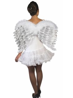 a woman in a white dress with angel wings