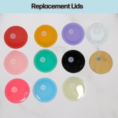 six different colored discs on a white surface with the words replacment lids above them