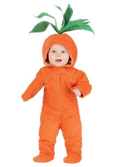 a baby in an orange costume with a green leaf on it's head and legs