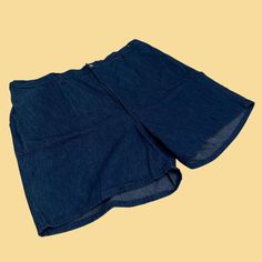 "Vintage denim shorts, manufactured ca. 1970s, still with the original tags attached. Moonshine (Lane & Bryant) brand plus size women's shorts in size 44 (could be worn fashionably by either gender today).     - Brand: Moonshine (Lane & Bryant)    - Size: Size 44    - Time Period: 1970s    - Color(s): Denim blue    - Materials: 100% cotton    - Made in: Made in USA    - Condition: In new old stock, vintage condition with original tags (this piece was stored in a dresser after purchase and never Retro Wide Leg Cotton Shorts, Retro Cotton Cutoff Shorts, Retro Short Denim Shorts, Retro Denim Bottoms With Built-in Shorts, Retro Short Denim Blue Jeans, Retro Relaxed Fit Denim Shorts, Vintage Denim Jean Shorts For Summer, Retro Style Medium Wash Shorts For Summer, Retro Jean Shorts With Pockets