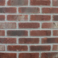 a red brick wall that is very close to the ground