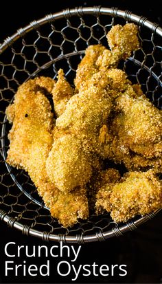 fried oysters in a wire basket with the words crunchy fried oysters