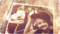 a young boy wearing a hat and holding a baseball bat